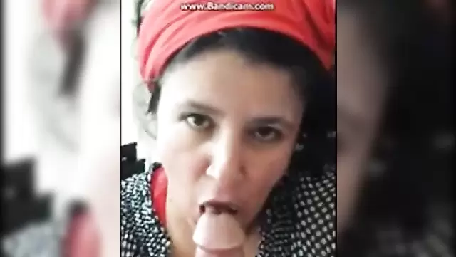 A mature Turkish woman in a scarf gives a good blowjob